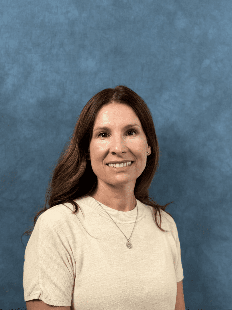 Smiling woman portrait against blue background