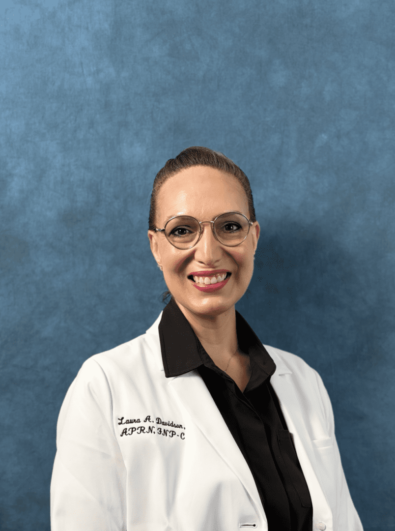 Smiling healthcare professional wearing glasses and white coat
